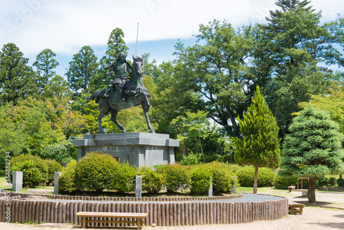 Kanamori Nagachika Statue at Ruins of Tkayama castle in Shiroyama Park. a famous historic site in Takayama, Gifu, Japan. photo