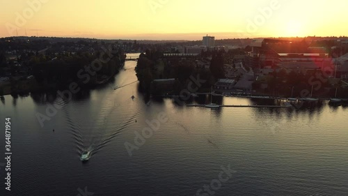 Orbiting Aerial of Seattle Sunset Boating Through Montlake Cut by University of Washington photo