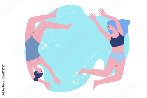 Two girls in bikini swimming in the pool