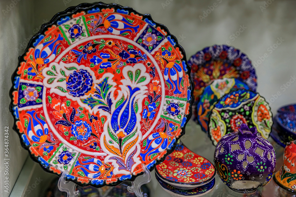 Montenegrin hand painted decorative plates with a floral pattern in at a souvenir shop in Kotor old town in Montenegro Montenegrin hand painted decorative plates with a floral pattern in at a souvenir shop in Kotor old town in Montenegro