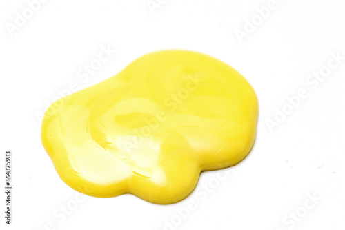 Close Up of Melting Cheese Isolated on White Background. Creamy Cheese Drop