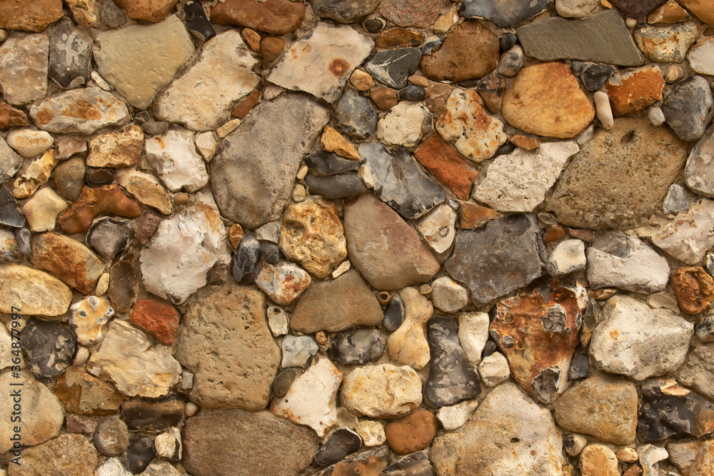 Multi color Stone wall abstract texture in different rocks Multi color Stone wall abstract texture in different rocks