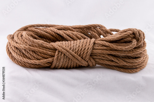 Coiled jute rope starting with ends and bight locked with tuck under
