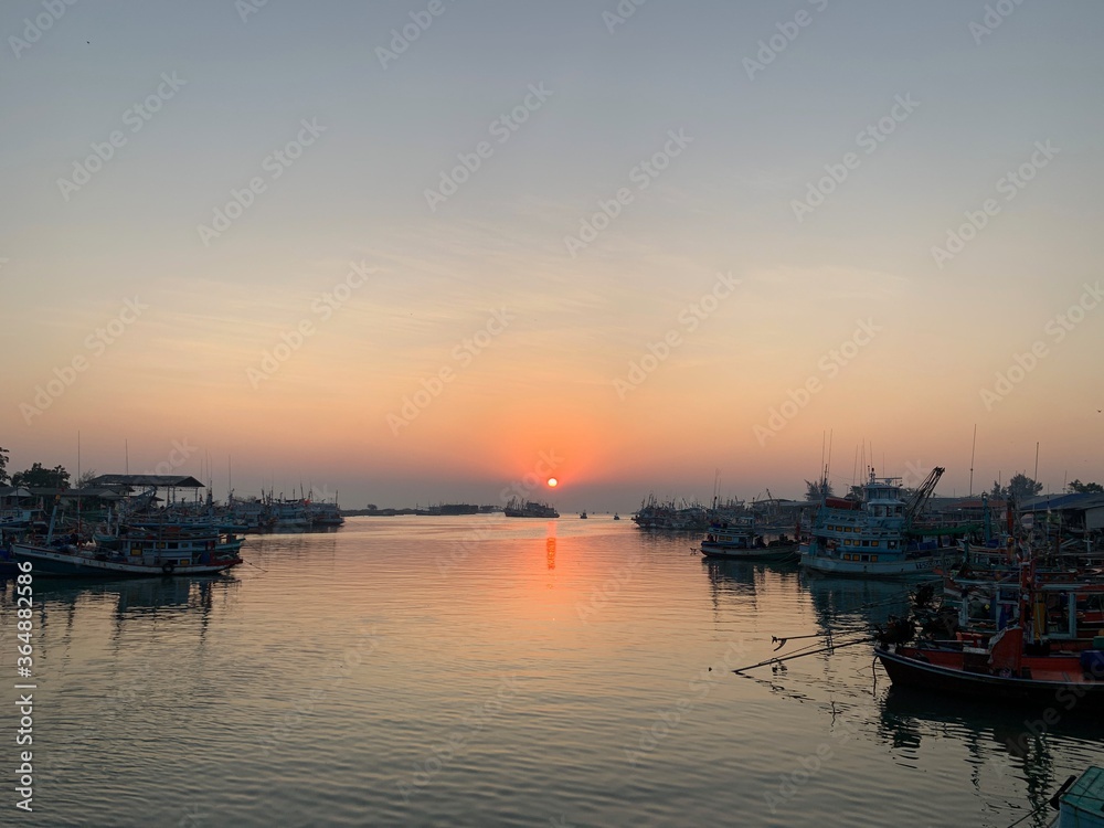 Waterfront atmosphere Sunrise fishing boat