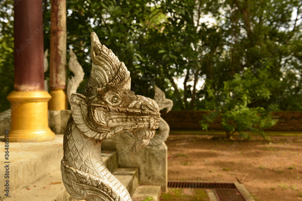 Ancient Naga on staircase of Wat U-Mong Chiang Mai province, Thailand. Ancient Naga on staircase of Wat U-Mong Chiang Mai province, Thailand.