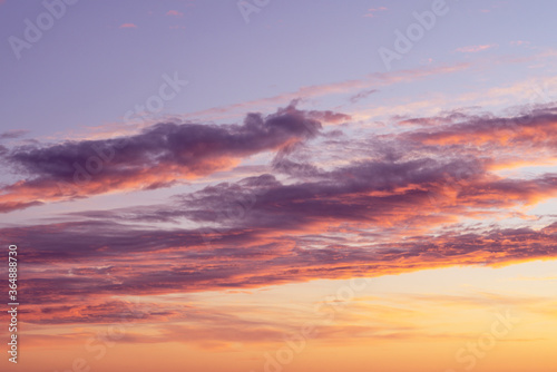 Cloudy sunset in orange and violet colors