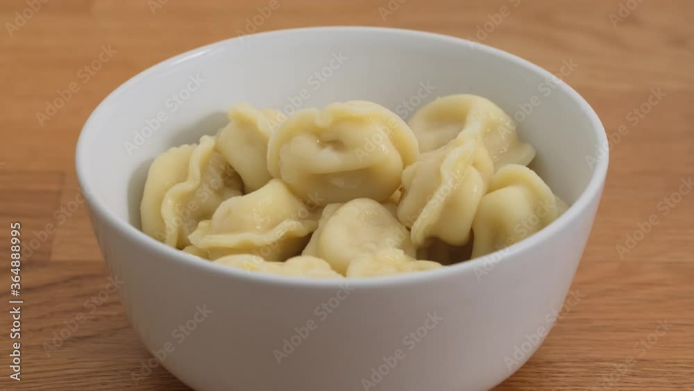 Bowl of homemade boiled dumplings close up Bowl of homemade boiled dumplings close up