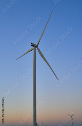 wind generators generate energy against the sky