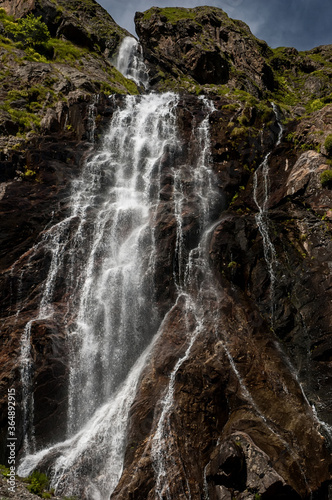 waterfall in the mountains, Small waterfall near the cave in mountains