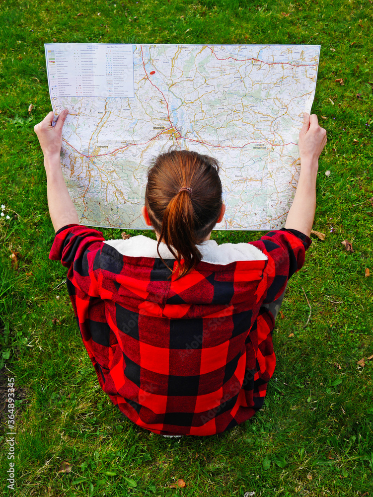girl reading a maps