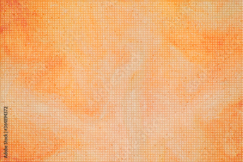 細かいドットのパターンの橙色の背景
