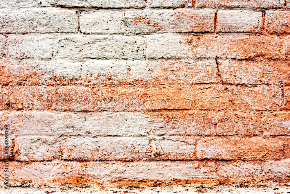Texture of a brick wall with cracks and scratches which can be used as a background Texture of a brick wall with cracks and scratches which can be used as a background