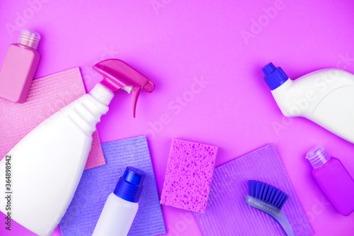 House cleaning products are on purple background.