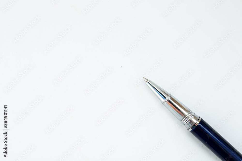 pen on a piece of a paper pen on a piece of a paper
