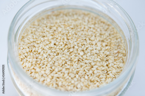 sesame in a jar on a white background