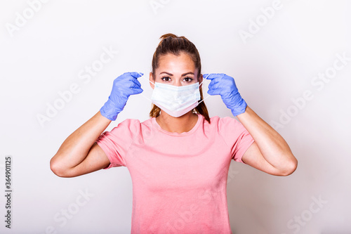 Portrait of young woman wearing face protective mask to prevent Coronavirus and anti-smog. Portrait of young woman wearing face mask. Covid-19 prevention concept