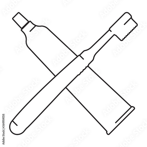 crossed toothbrush and paste