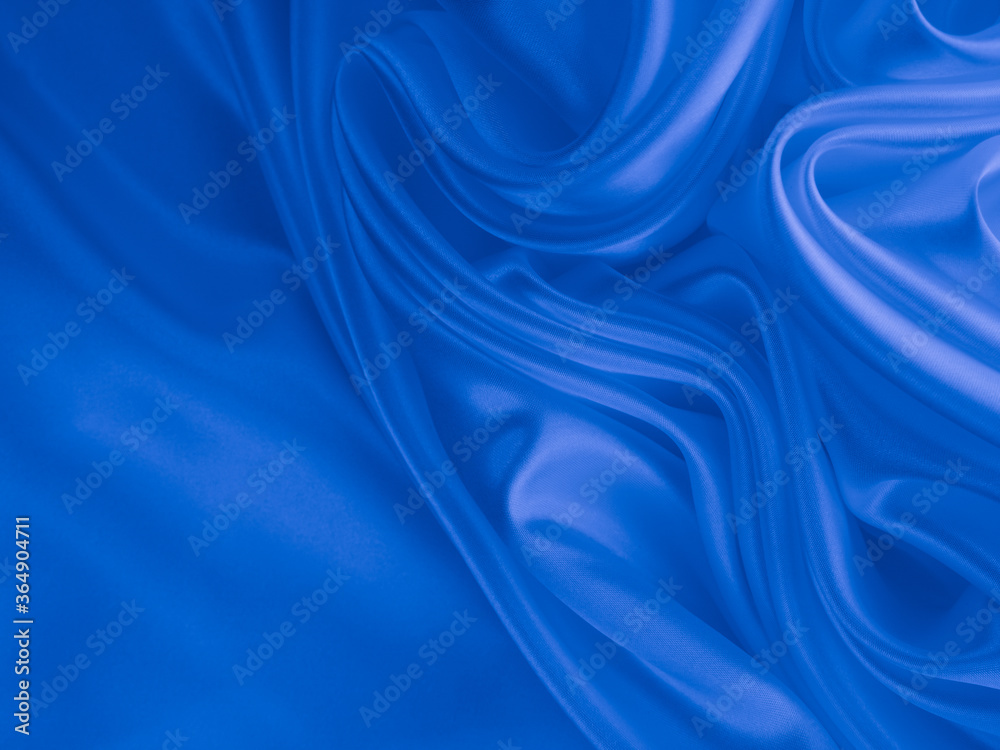 Obraz premium Beautiful elegant wavy classic blue satin silk luxury cloth fabric texture, abstract background design.