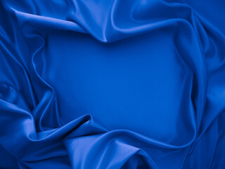 Beautiful elegant wavy classic blue satin silk luxury cloth fabric texture, abstract background design.
