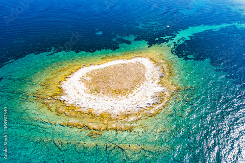 Adriatic coastline in Croatia, beautiful small island of Mali Lagan in turquoise sea in Dugi Otok archipelago, aerial view of from drone

