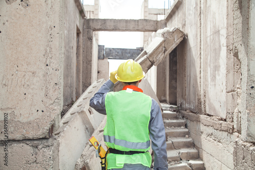 Construction worker with helmet in outdoors.