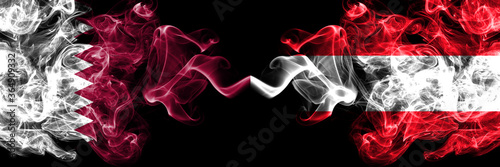 Qatar vs Austria, Austrian smoky mystic flags placed side by side. Thick colored silky abstract smoke flags.