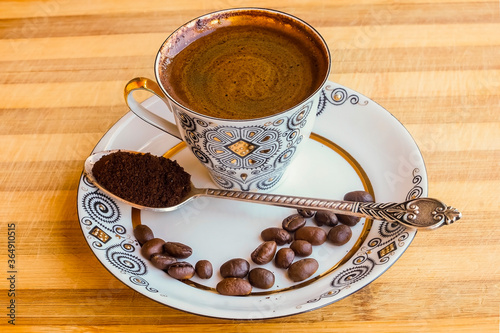 coffee Cup with coffee beans on a saucer