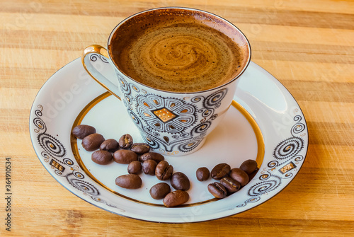 coffee Cup with coffee beans on a saucer