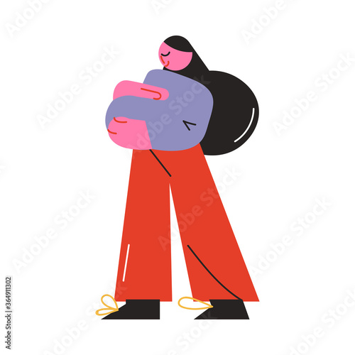 Pregnant woman standing and embracing her tummy during walk