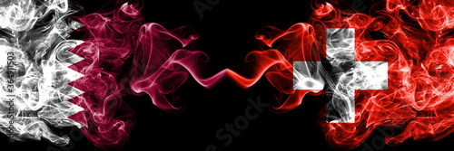 Qatar vs Switzerland, Swiss smoky mystic flags placed side by side. Thick colored silky abstract smoke flags.