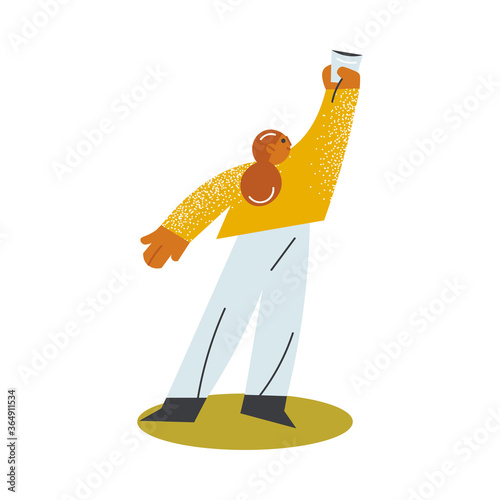 Girl standing and holding cup with drink in raised hand on open veranda