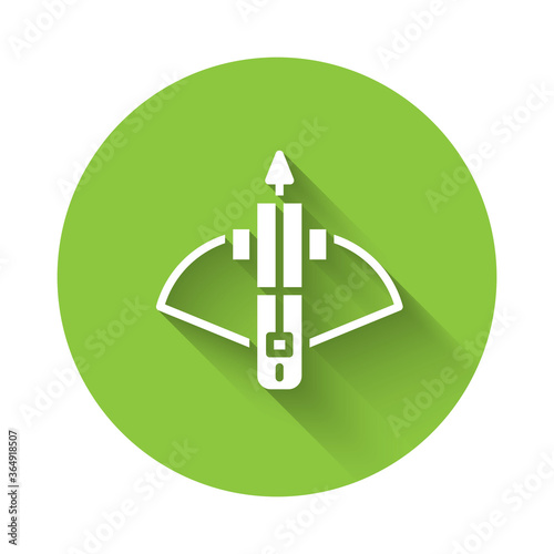 White Battle crossbow with arrow icon isolated with long shadow. Green circle button. Vector.