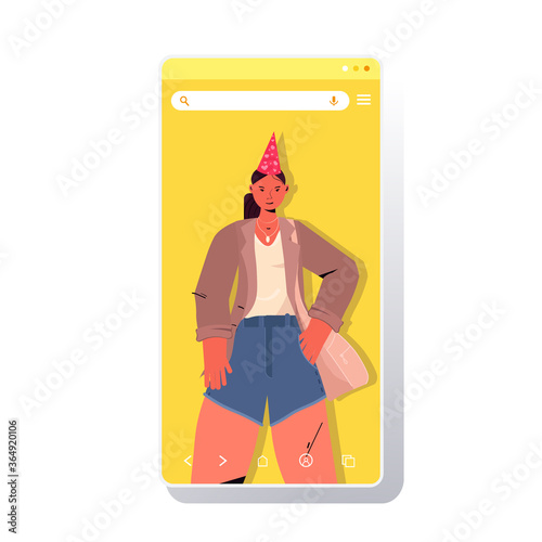 woman in festive hat celebrating online birthday party girl in smartphone screen having fun celebration self isolation quarantine concept portrait vertical vector illustration