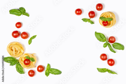 Frame of cherry tomatoes, pasta and basil leaves on a white isolated background. Fresh food. Flat lay. Copy space.