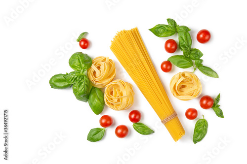Cherry tomatoes, spaghetti and basil leaves on a white isolated background. Ingredients for pasta. Flat lay. Copy space.