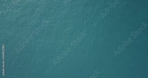 aerial video of the blue sea from a low altitude with small waves
