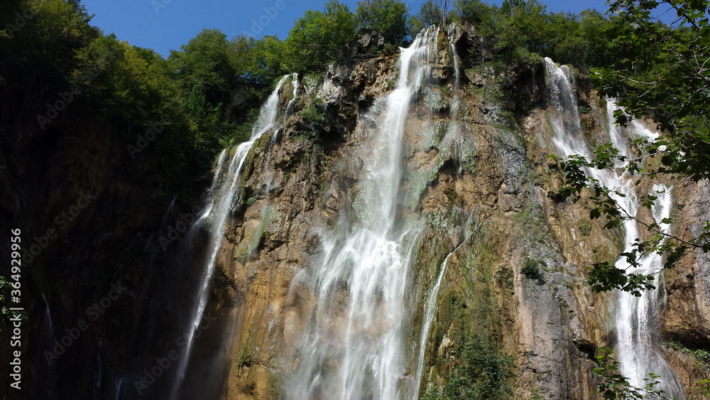 Waterfalls in Plitvice Park, water falling from top of the hill dow to a small lake, shutter speed medium and the water makes a nice flowing effect. Waterfalls in Plitvice Park, water falling from top of the hill dow to a small lake, shutter speed medium and the water makes a nice flowing effect.