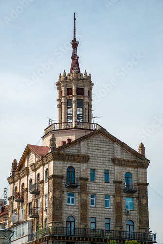 House built in the forties and fifties of the twentieth century in the spirit of pretentious Soviet buildings. On the roof there is a turret with columns and a spire at the top. © alastis