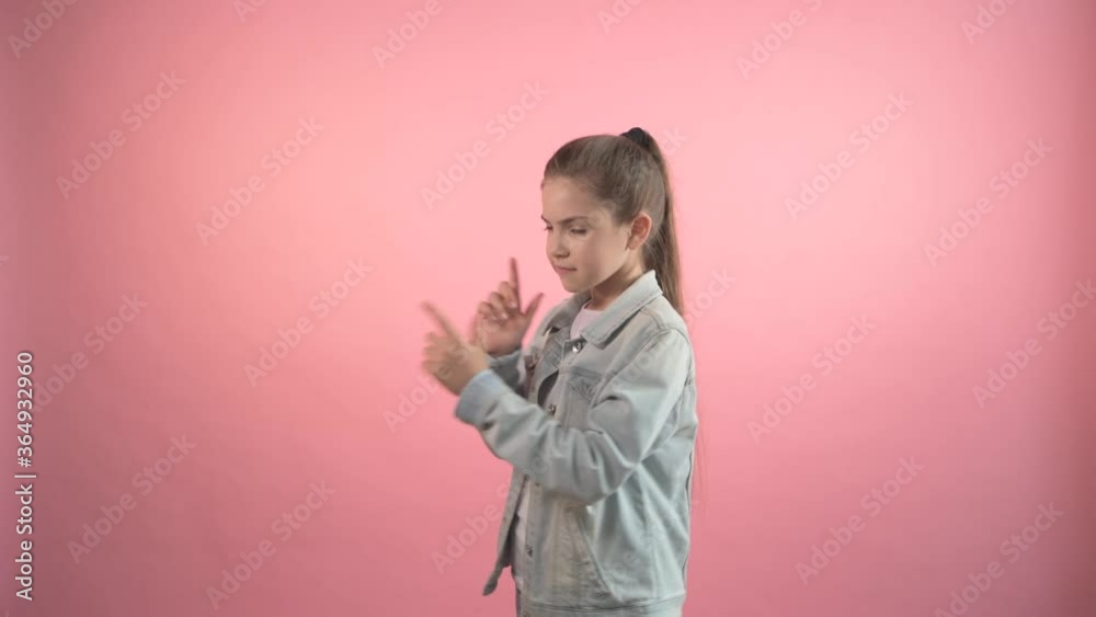 Child girl points fingers in different directions. Child girl points fingers in different directions.
