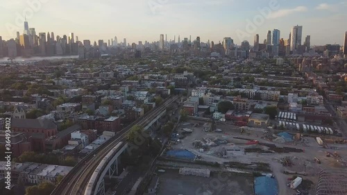 Aerial view of New York skyline from the Brooklyn train tracks during sunset