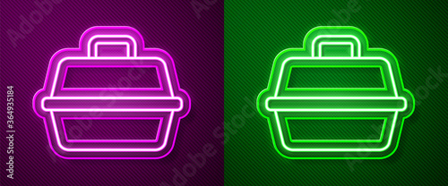 Glowing neon line Pet carry case icon isolated on purple and green background. Carrier for animals, dog and cat. Container for animals. Animal transport box. Vector.