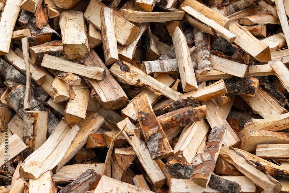A pile of chopped birch firewood. Harvesting for the winter. A pile of chopped birch firewood. Harvesting for the winter.