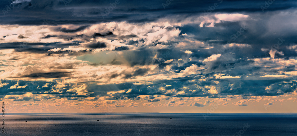 aerial view over the sea and evening clouds