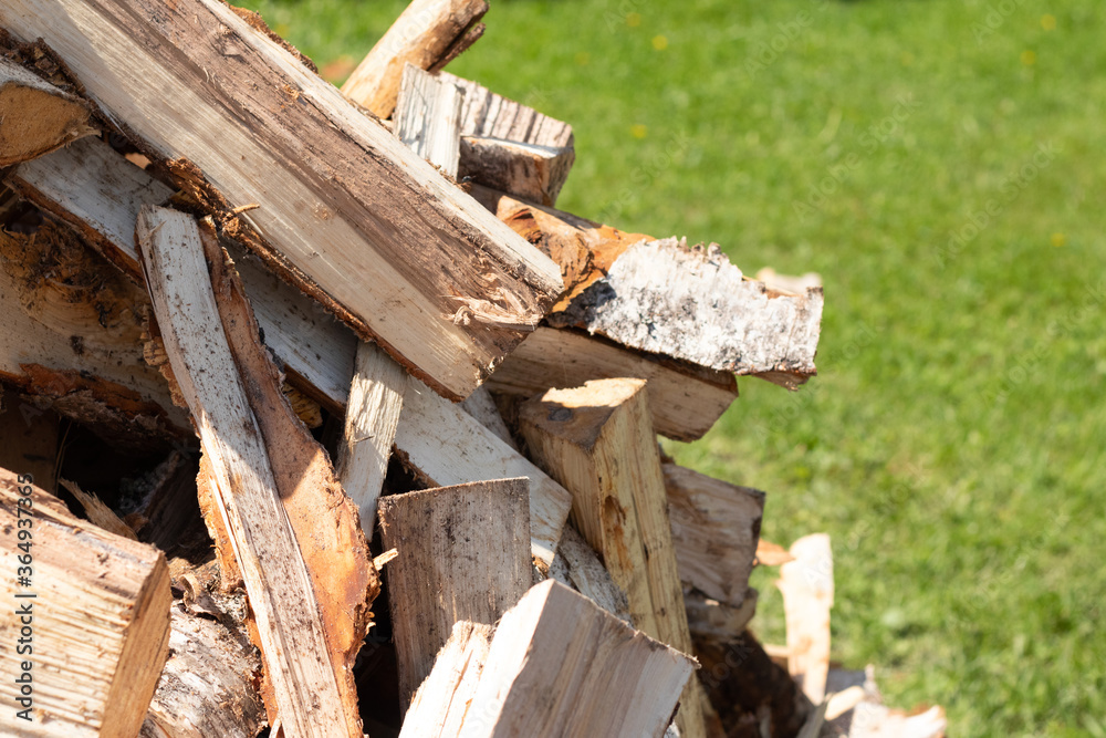 A pile of chopped birch firewood. Harvesting for the winter. A pile of chopped birch firewood. Harvesting for the winter.