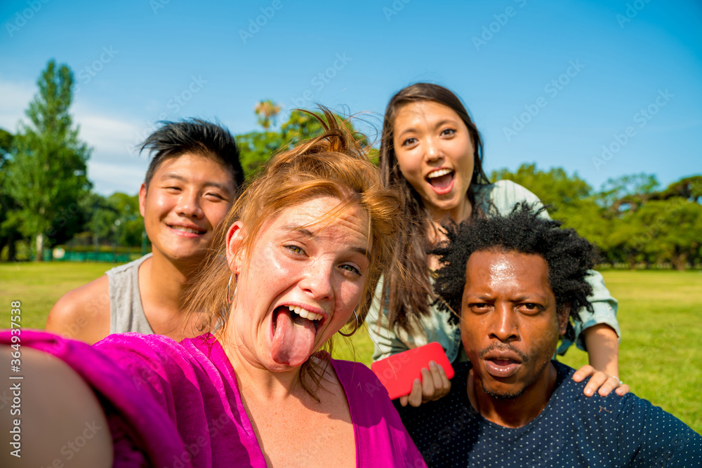 Selfie of a happy group of friends during summertime
