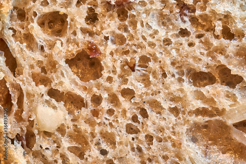 Abstract background and texture from a close-up of a piece of sliced bread roll  macro