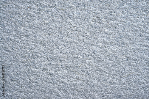 Abstract background and texture from a close-up of a rough thick paper, macro