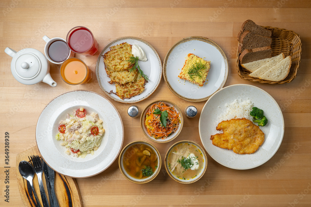 Russian buffet: assorted soups, salads and appetizers, cabbage soup, borscht, mushroom soup, fruit drinks, coated herring Russian buffet: assorted soups, salads and appetizers, cabbage soup, borscht, mushroom soup, fruit drinks, coated herring