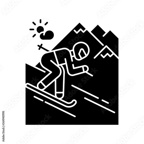 Skiing black glyph icon. Winter vacation, seasonal extreme tourism silhouette symbol on white space. Active recreation at alpine ski resort. Sportsman skiing downhill Vector isolated illustration