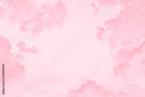 Pink coral clouds in the light pink sky, copy space